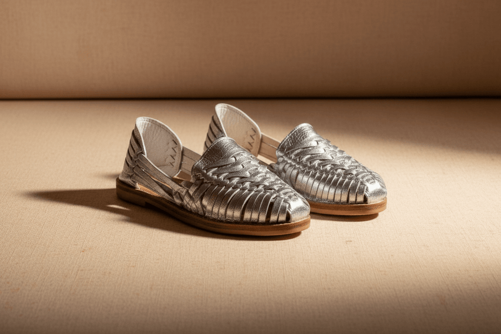 Handmade leather Mexican Huarache sandals by TAILOR LEATHER with intricate woven straps and a natural leather sole.