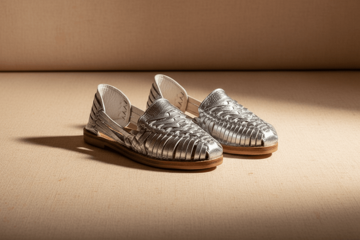 Handmade leather Mexican Huarache sandals by TAILOR LEATHER with intricate woven straps and a natural leather sole.
