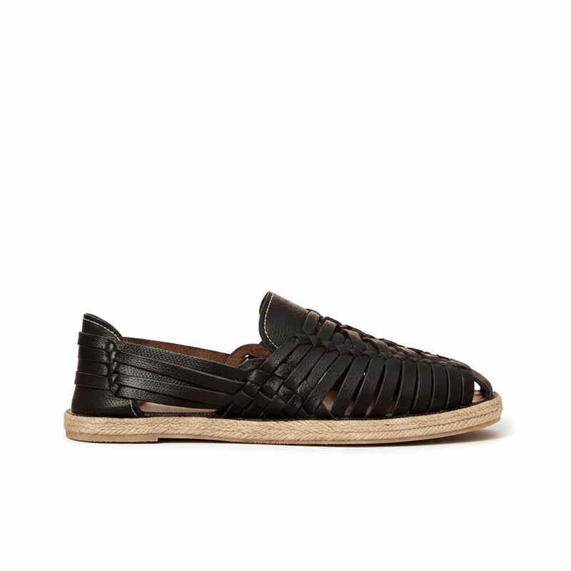 Stylish handmade black leather Mexican Huarache sandal by TAILOR LEATHER, featuring woven straps and traditional design details.