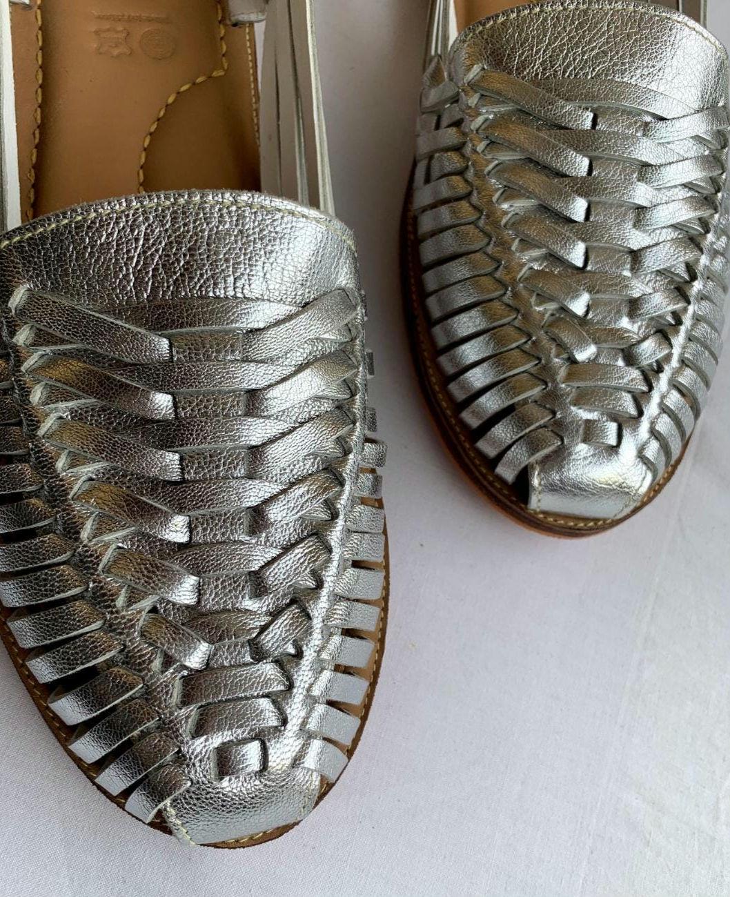 Handmade leather Mexican Huarache sandals by TAILOR LEATHER with woven straps and traditional design.