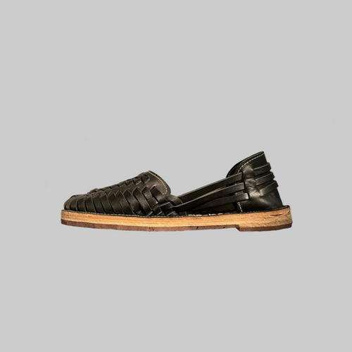 Handmade black leather Mexican Huarache sandal from TAILOR LEATHER featuring woven straps and a traditional design.